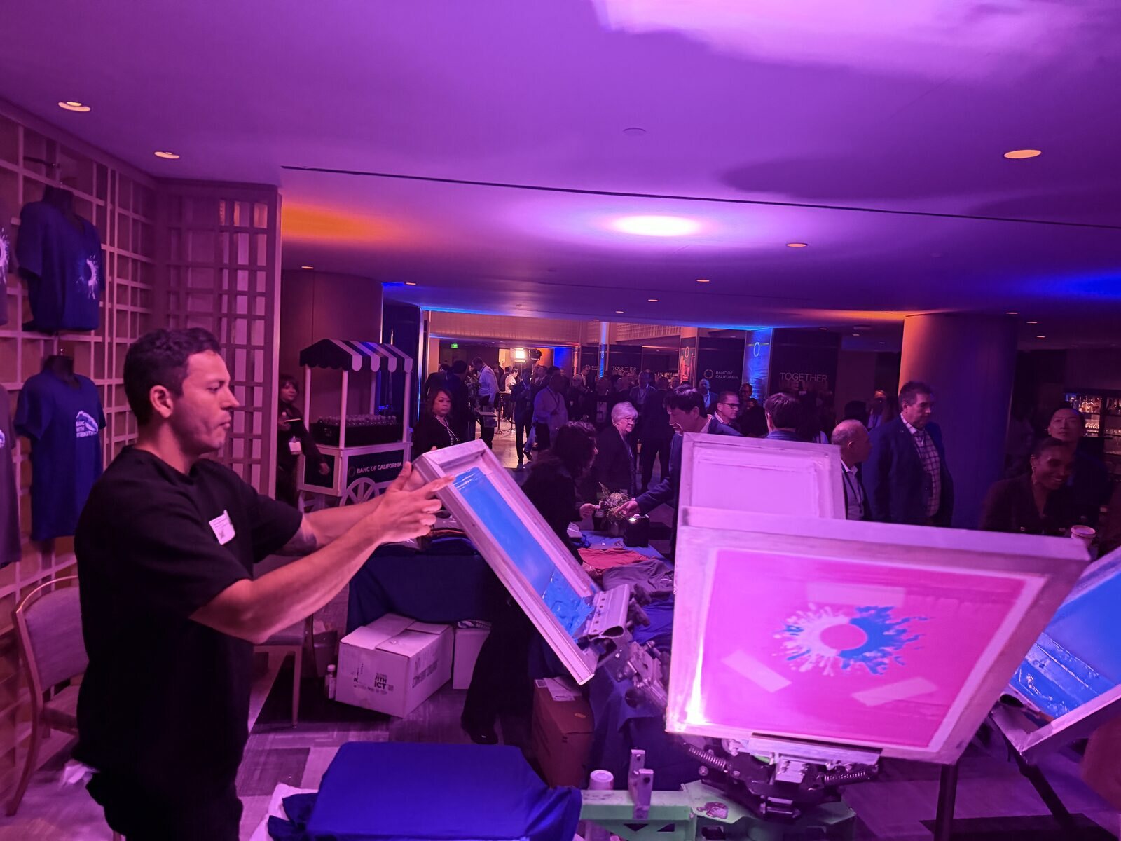 Merch Troop live screen-printing station running at a New Orleans event